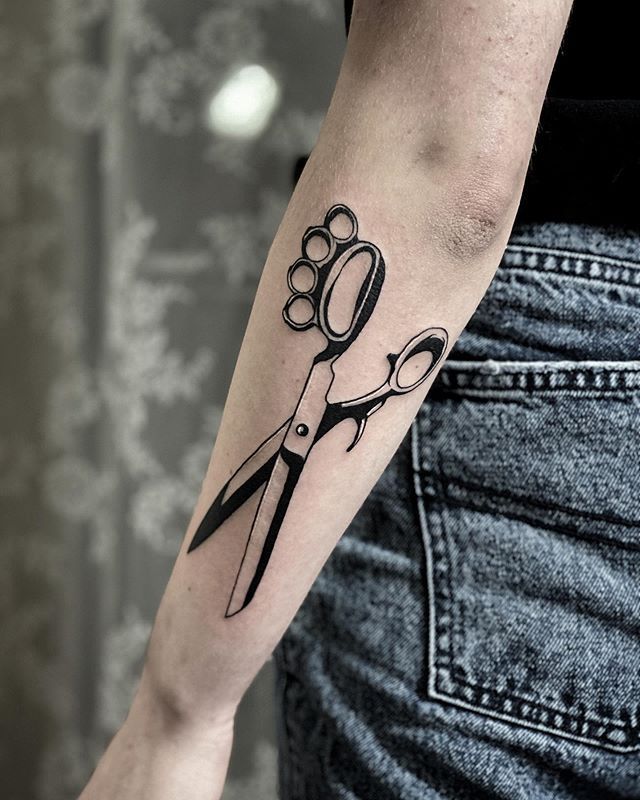 Knuckles and scissors tattoo on forearm for women