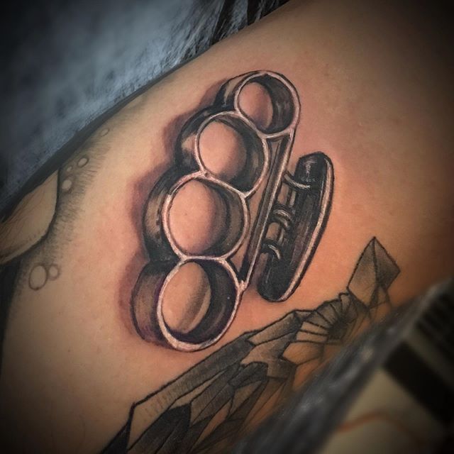 Knuckles tattoo on the arm for men