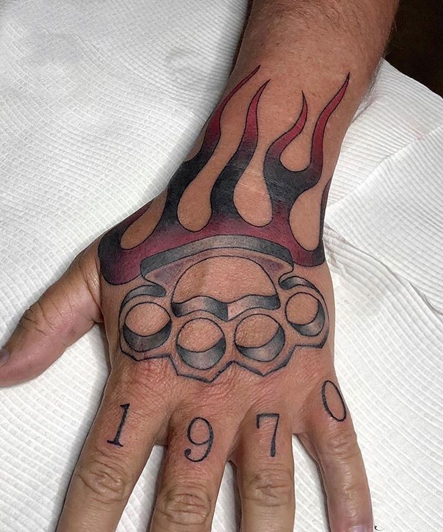 Knuckles tattoo on the hand for men