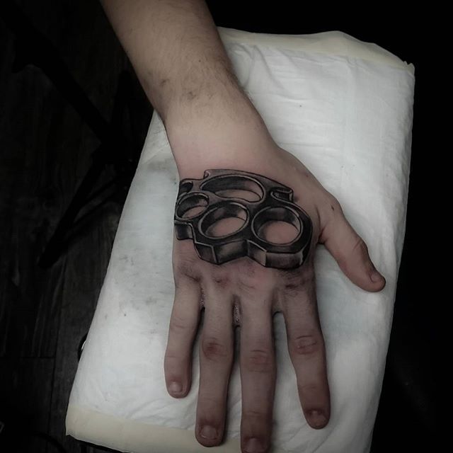 Knuckles tattoo on the hand for men