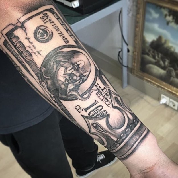 Money tattoo on forearm for men