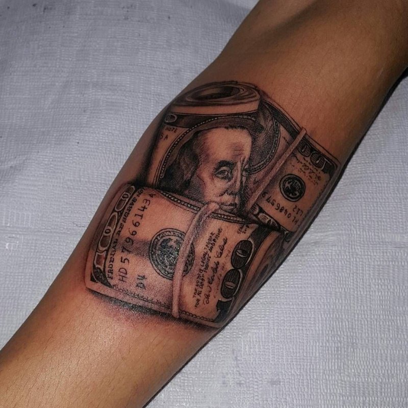 Money tattoo on arm for women