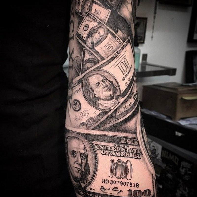 Large money tattoo on the arm for men