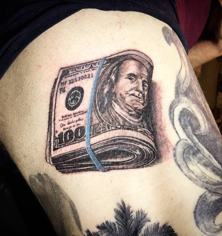 Money tattoo on thigh for men