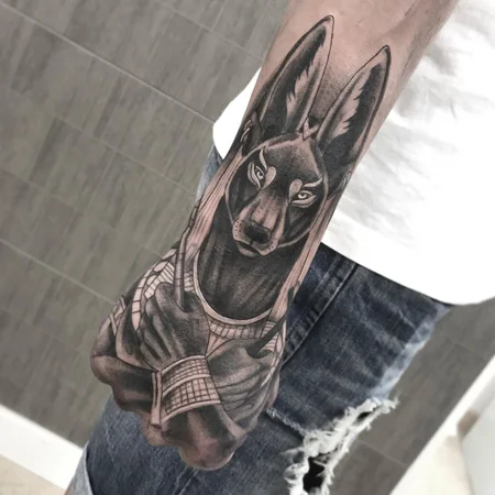 Anubis tattoo on the hand for men