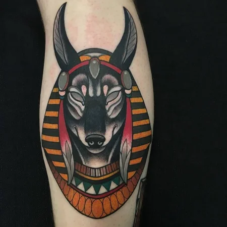 Anubis color tattoo on the calf for men