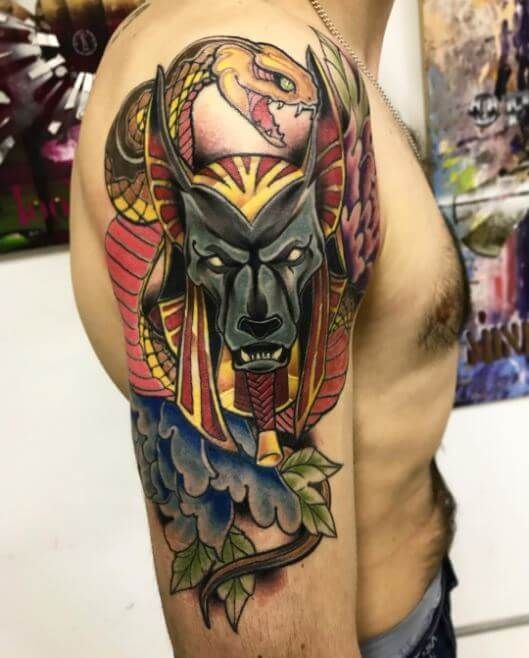 Anubis color tattoo on the shoulder for men