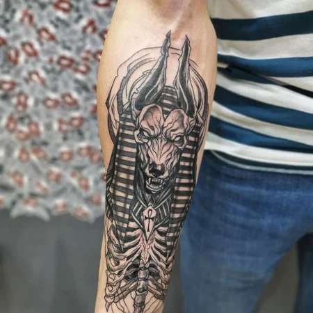 Large Anubis tattoo on forearm for men