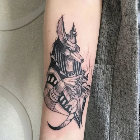 Anubis tattoo on forearm for women