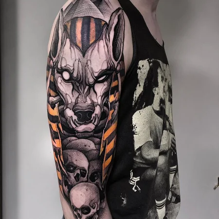 Anubis color tattoo on the shoulder for men