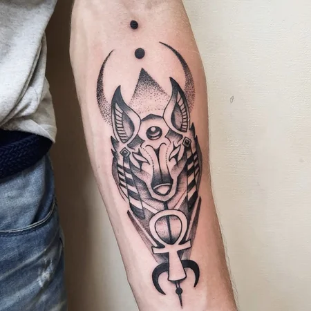 Anubis tattoo on forearm for men