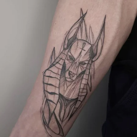 Anubis tattoo on forearm for men