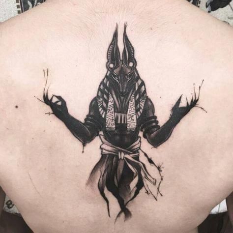 Anubis tattoo on the back for men