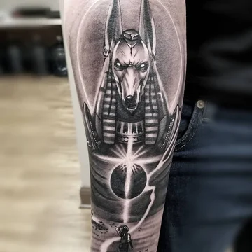 Anubis tattoo on forearm for men