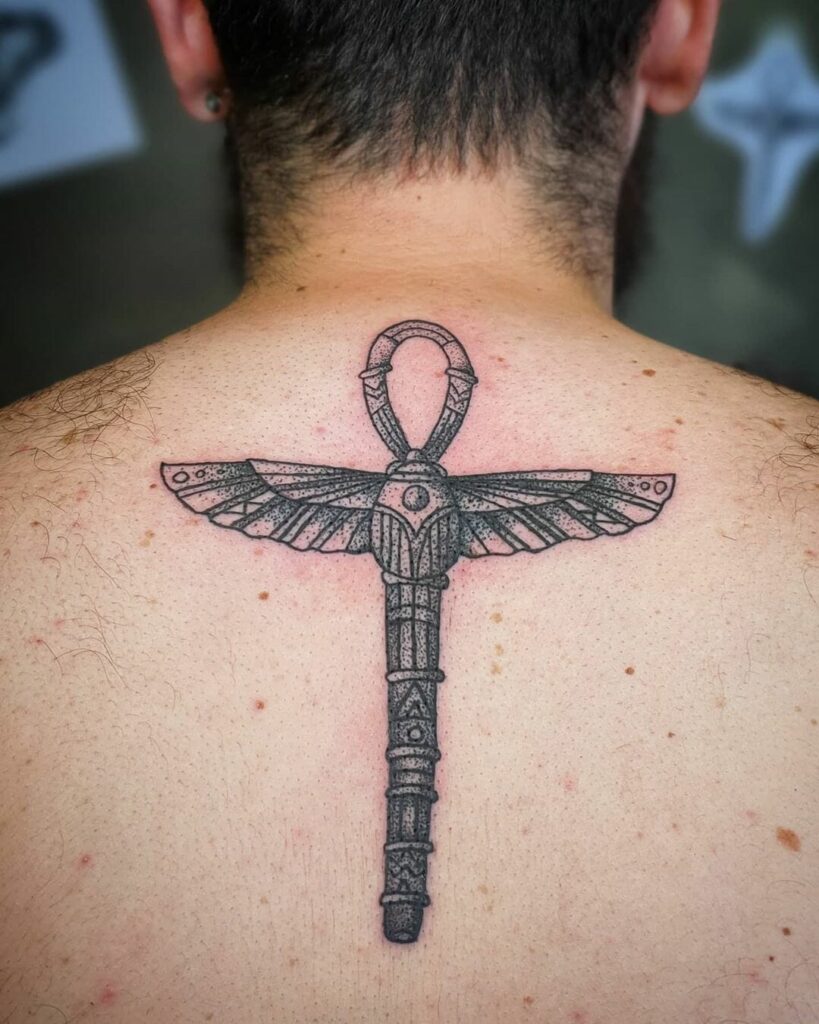 Ankh tattoo on the back for men