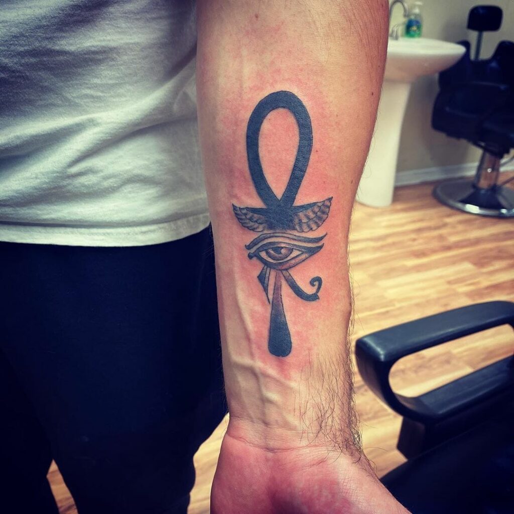 Ankh tattoo on forearm for men