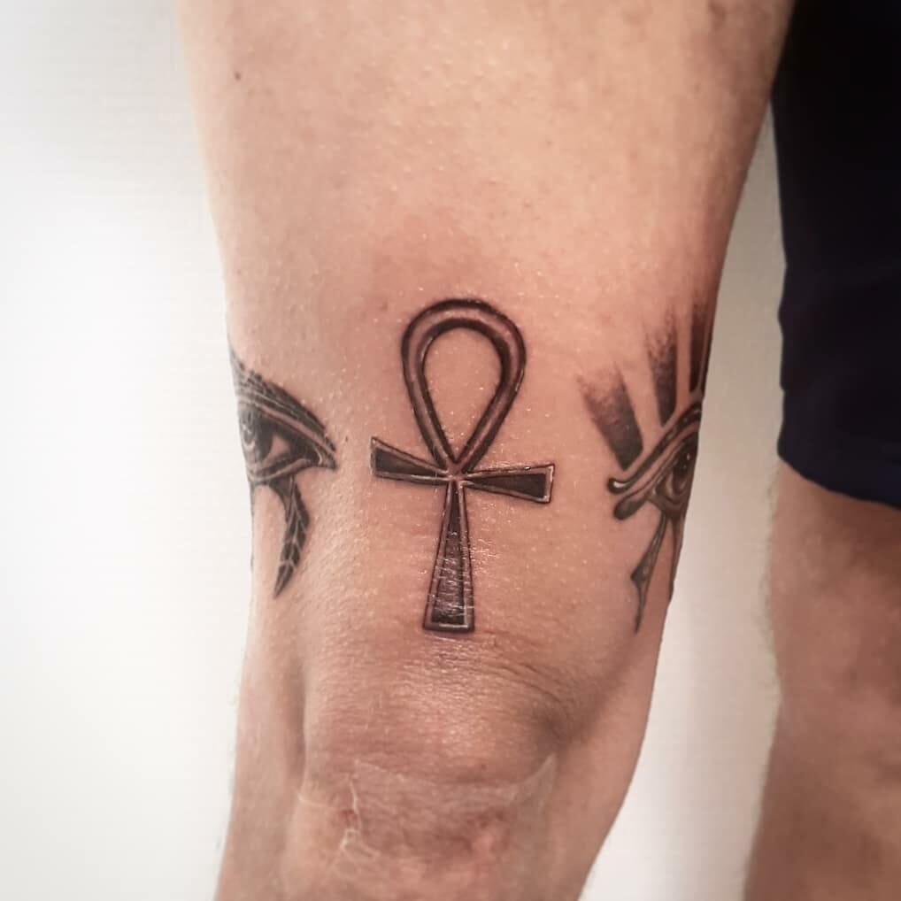 Ankh tattoo on the thigh for men