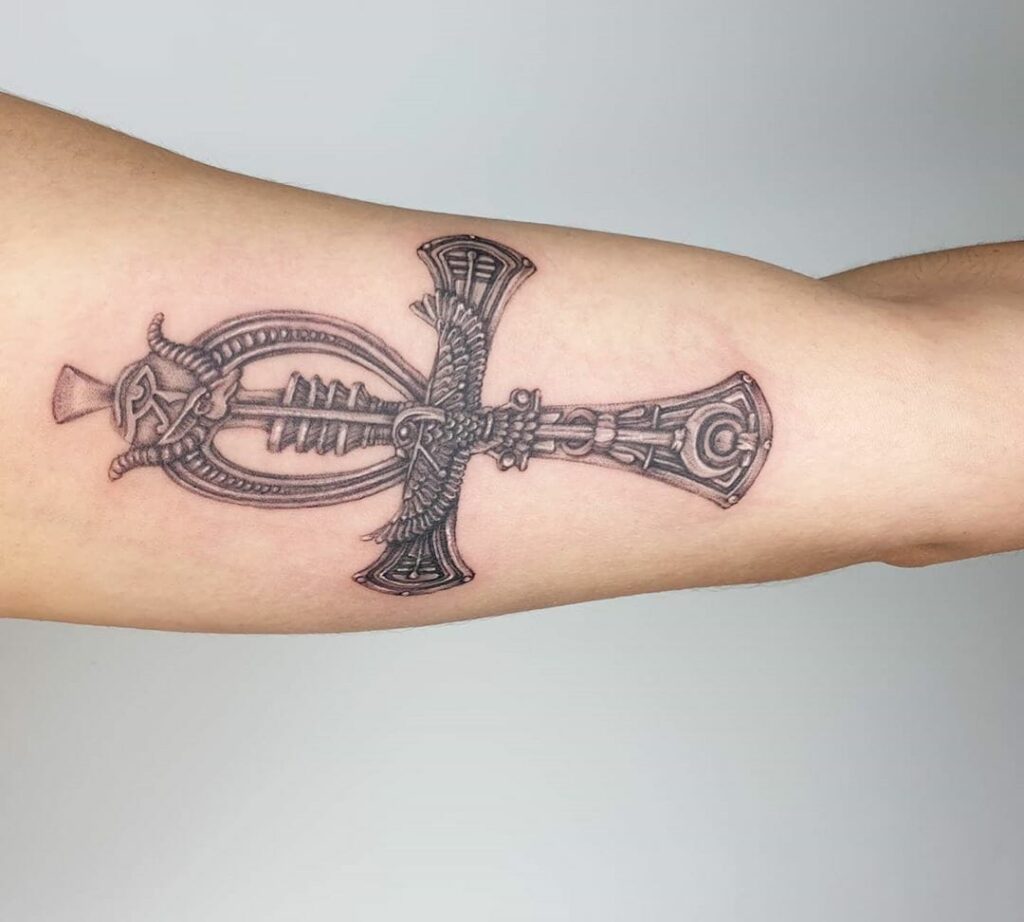 Ankh tattoo on the arm for women