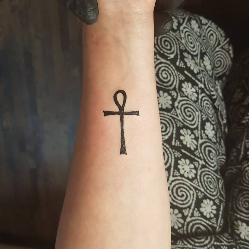 Ankh tattoo on forearm for women