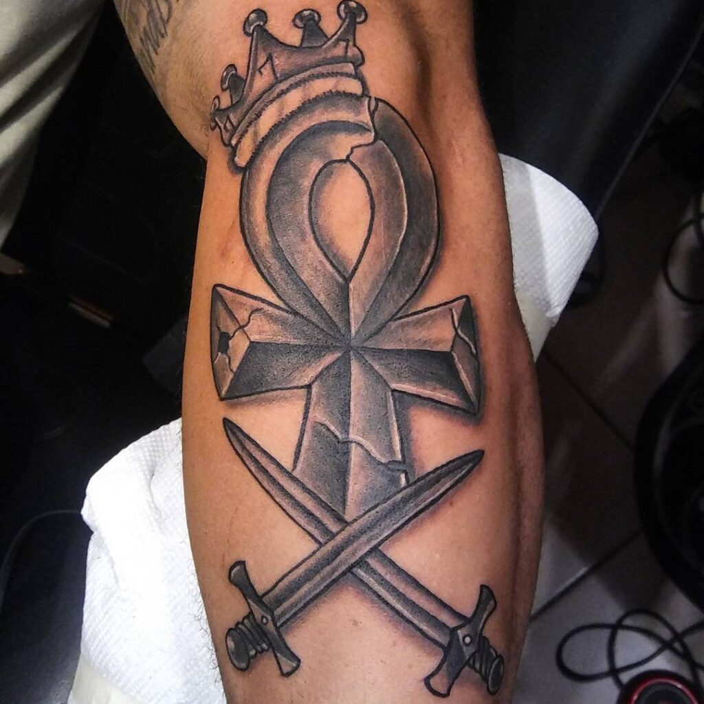 Large ankh tattoo on the leg for men