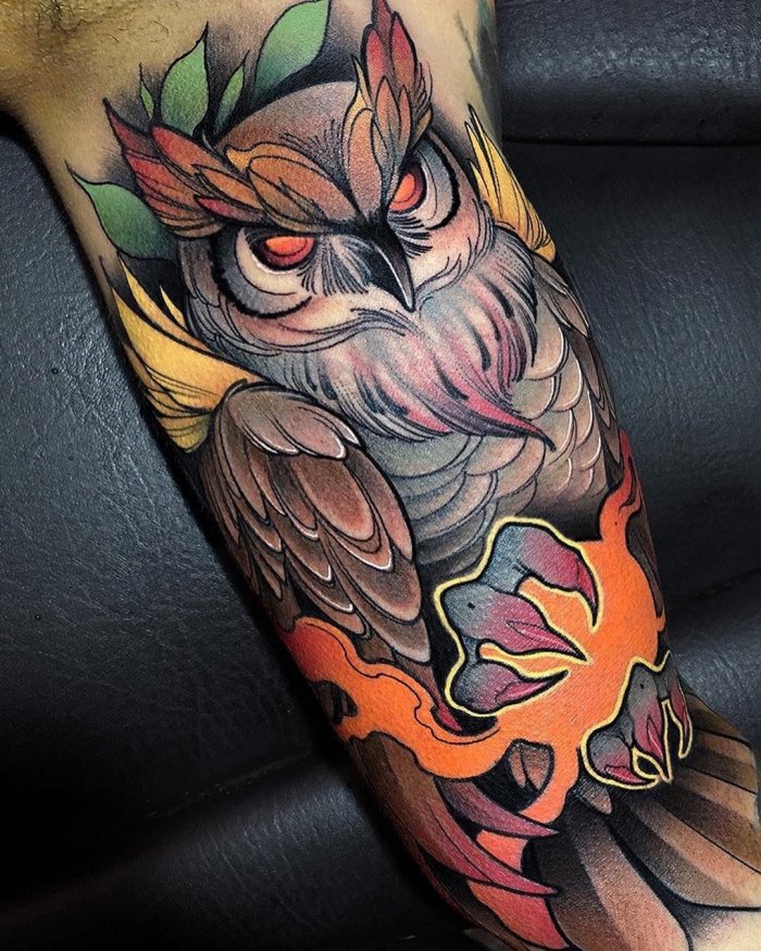 Colorful new-school owl tattoo on the arm for men