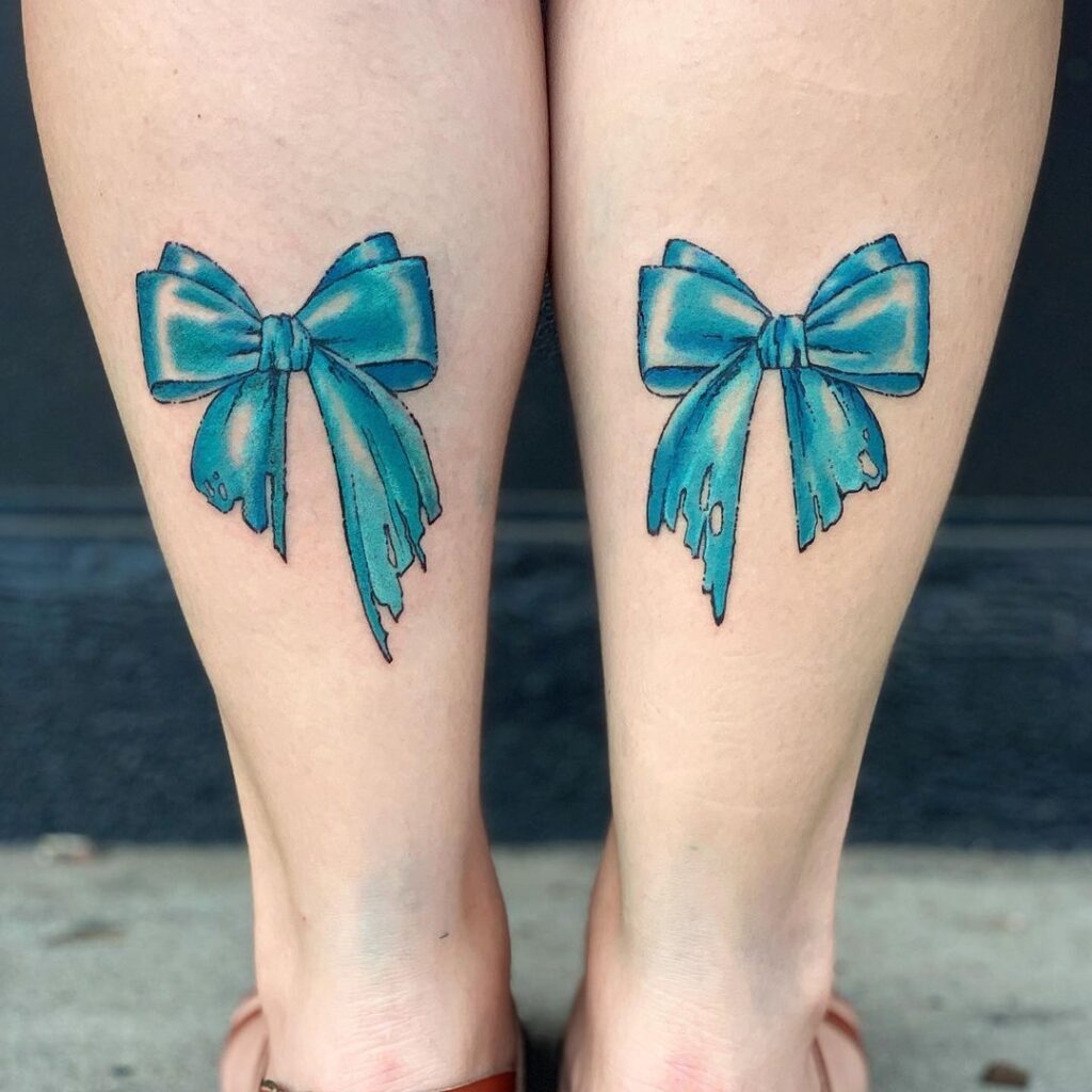 Bow tattoo on calf for women