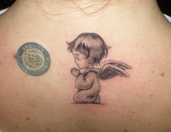 Angel tattoo on back for women