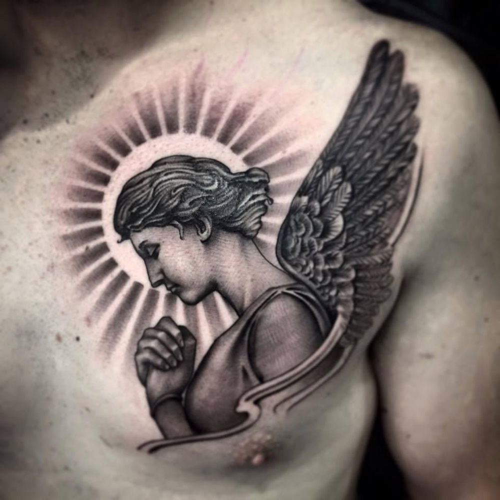 Angel tattoo on chest for men