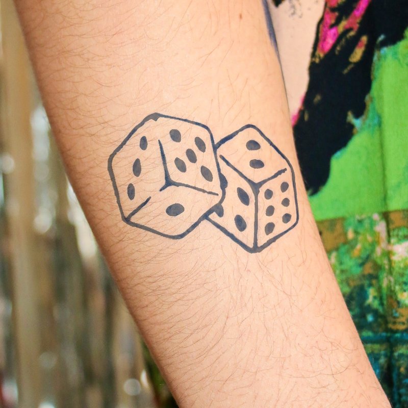 Dice tattoo on forearm for men