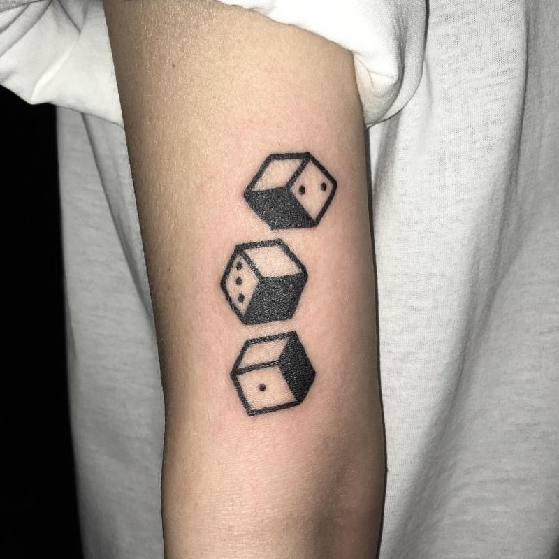 Dice tattoo on shoulder for women