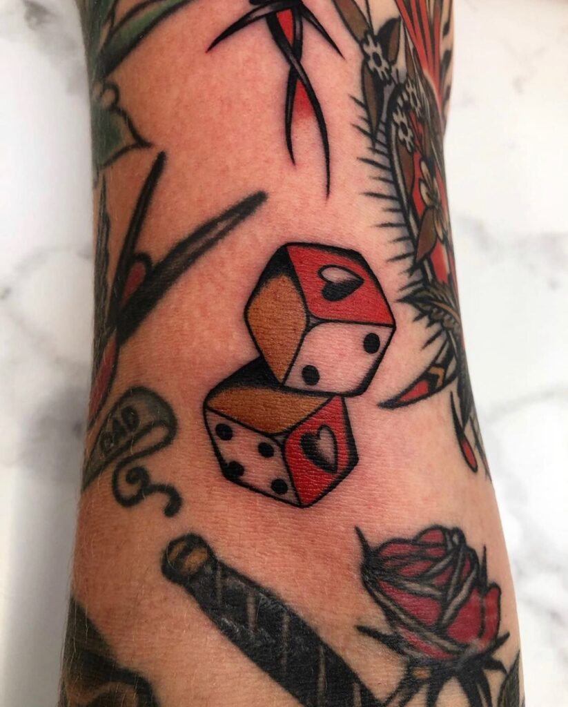 Dice tattoo on the arm for men