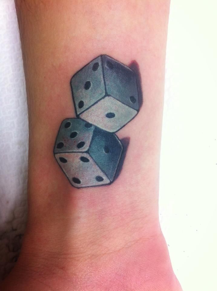 Dice tattoo on forearm for women