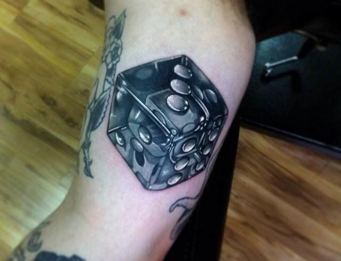 Dice tattoo on the shoulder for men