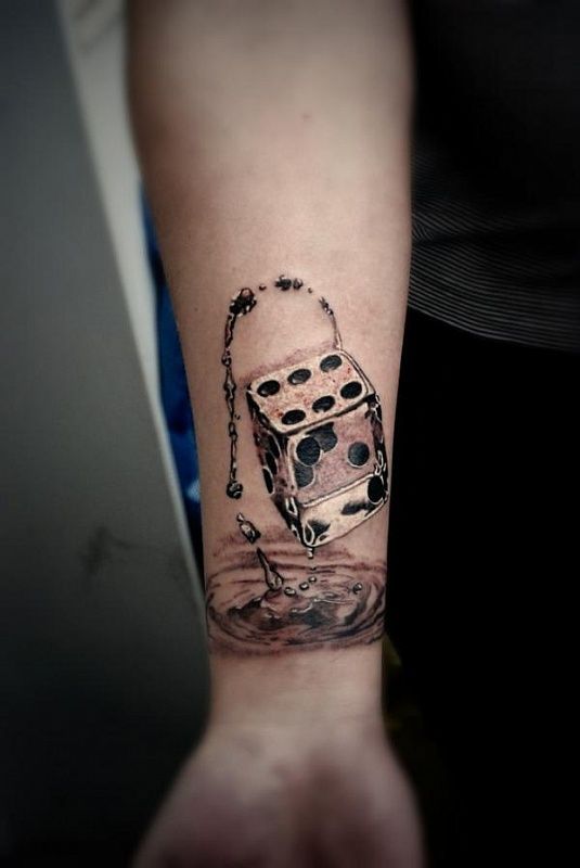 Dice tattoo on forearm for men