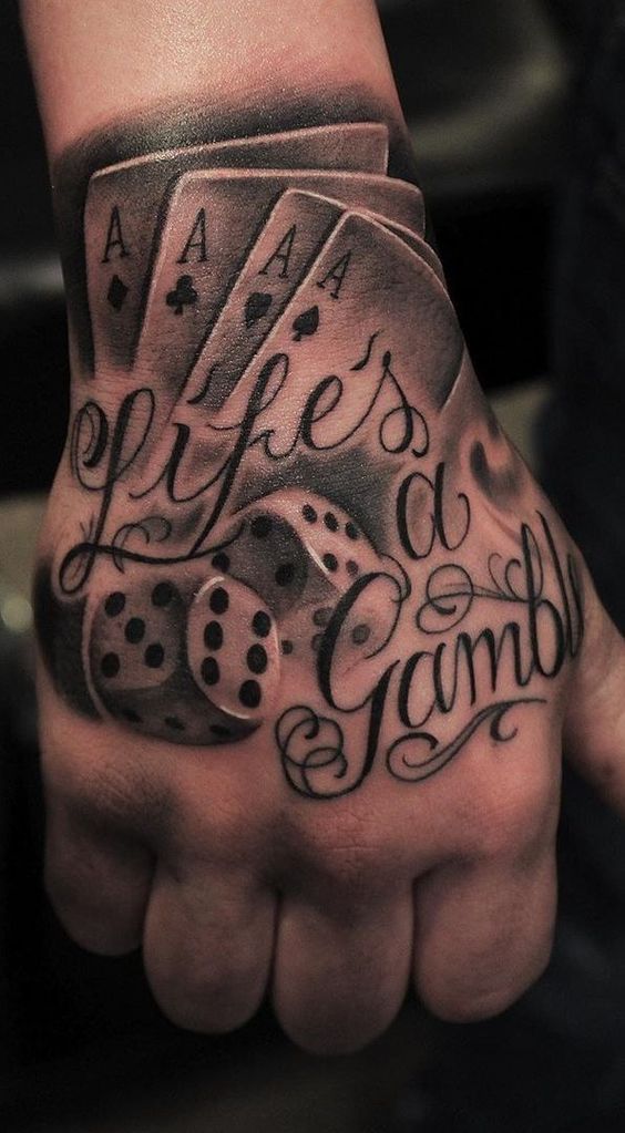 Dice tattoo with inscription on the arm for men