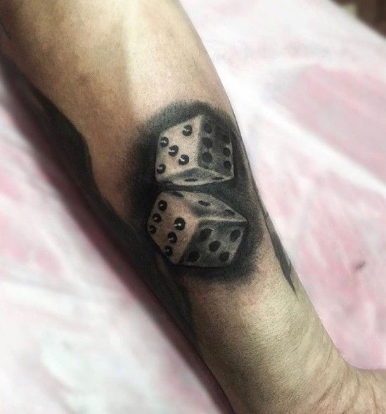 Dice tattoo on the arm for men