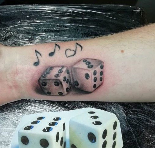 Dice tattoo on forearm for men