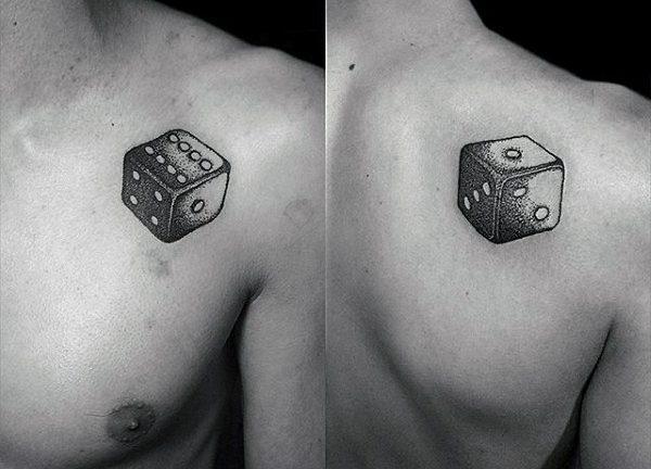 Dice tattoo on the shoulder blade for men