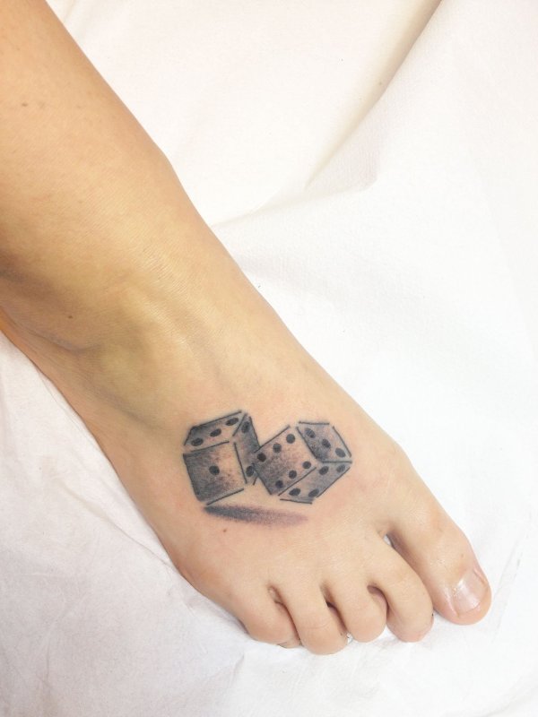 Dice tattoo on leg for women