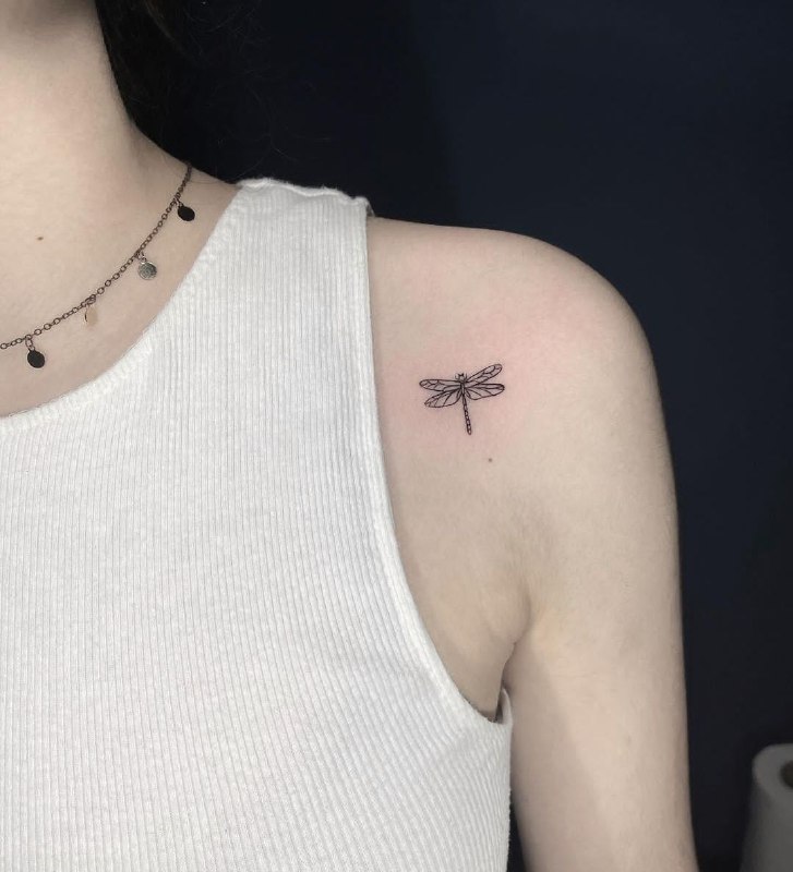 Minimalist tattoo on the shoulder for women