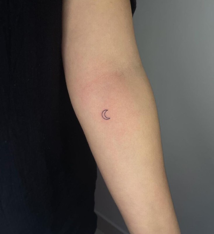 Minimalist style tattoo on the forearm for women