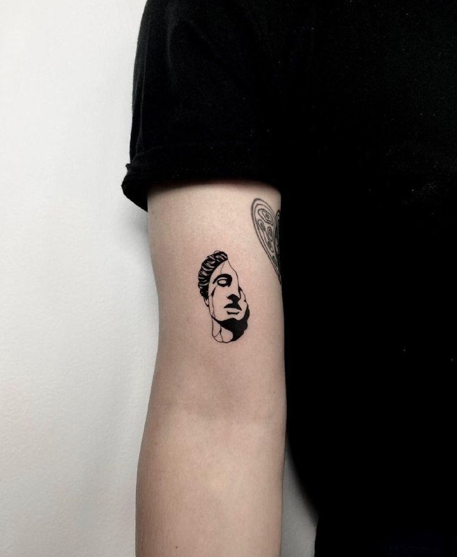 Minimalist tattoo on the shoulder for men