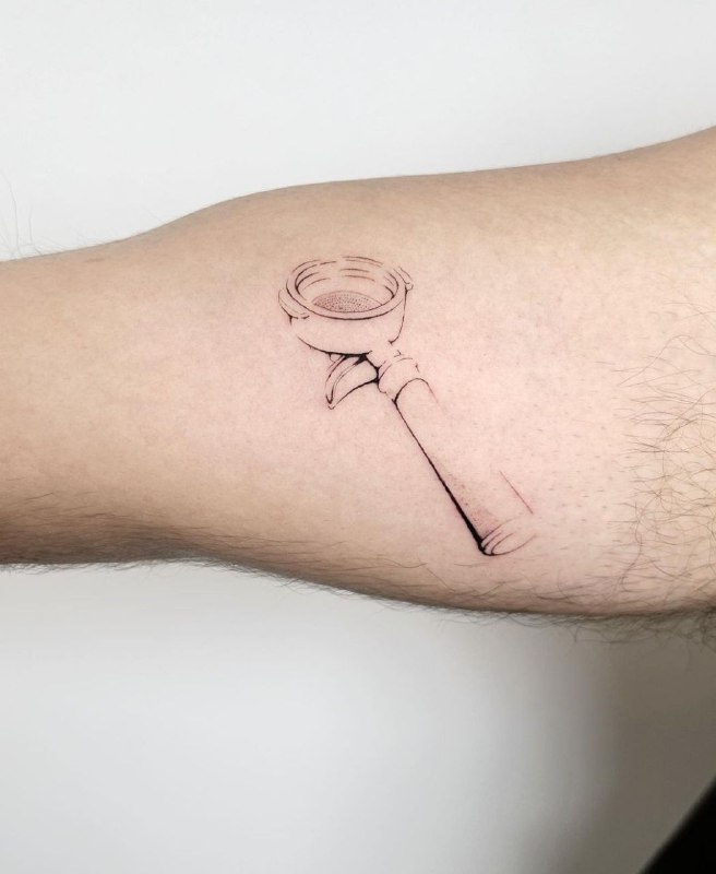 Minimalist tattoo on the arm for men