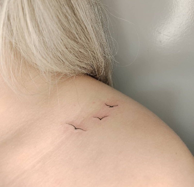 Minimalist tattoo on the shoulder for women