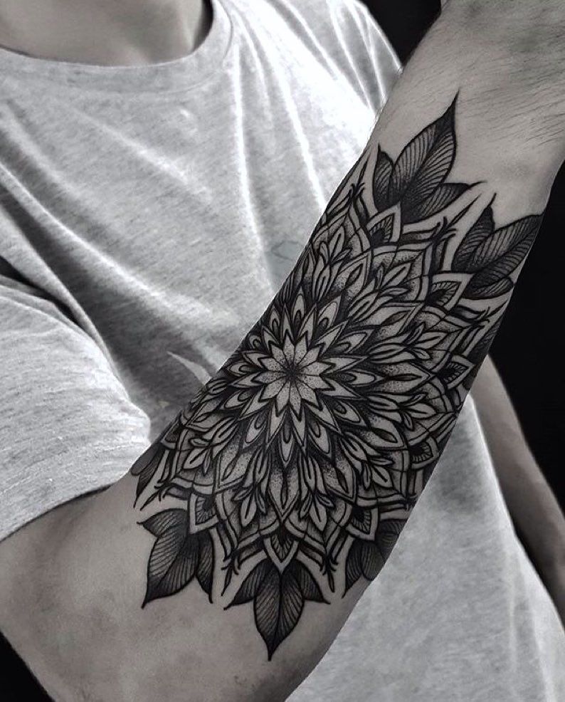 Ornamental style tattoo on the arm for men Ornamental style tattoo on the arm for men