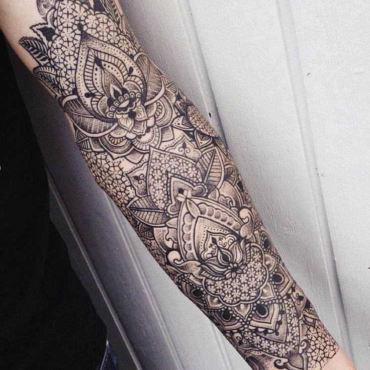 Ornamental style tattoo on the arm for men