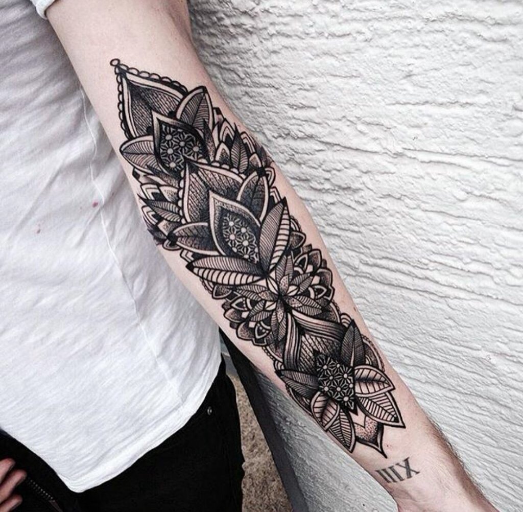 Ornamental style tattoo on the arm for women