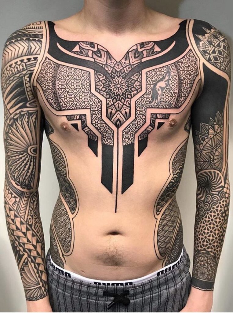 Ornamental style tattoo on the chest for men