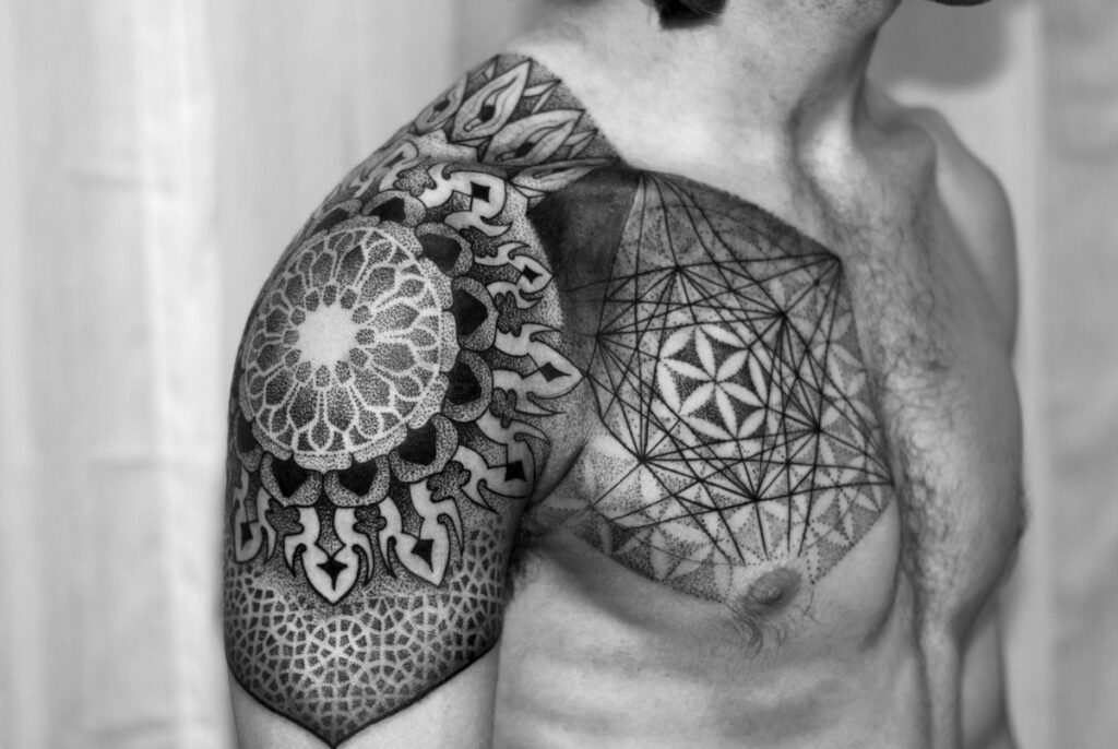 Ornamental style tattoo on the arm for men