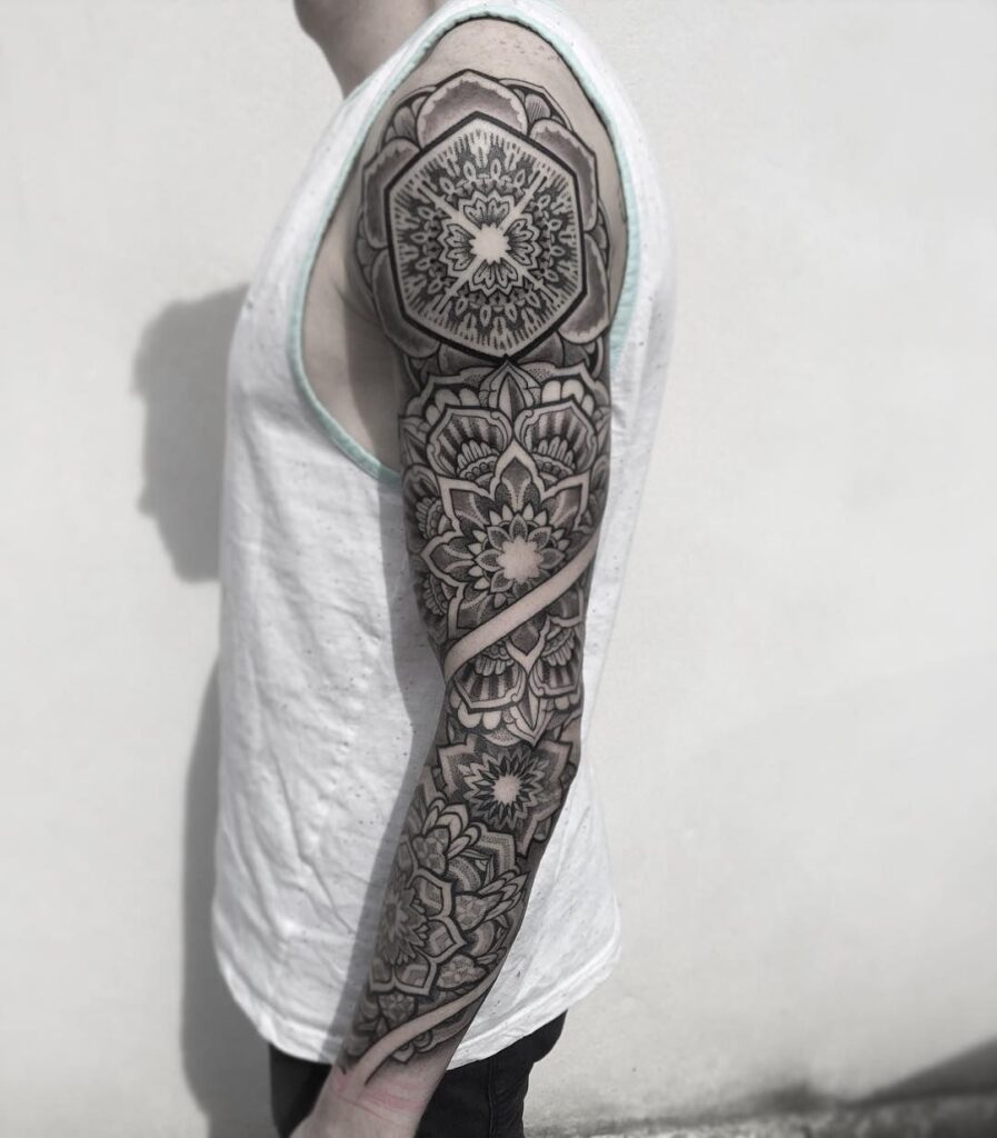 Ornamental style tattoo on the arm for men